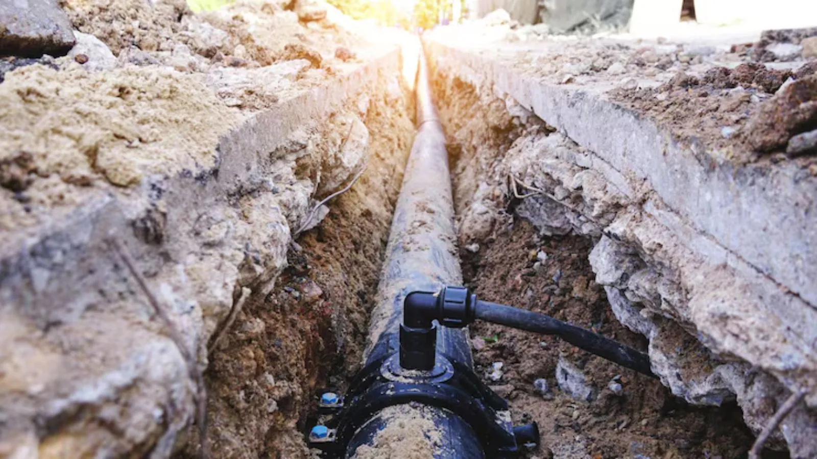 New water line being laid in an underground trench
